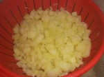 Lad kartoflerne dryppe af.