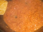 Tilsæt tomat, fløde, pastavand, salt og peber.