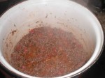 Tilsæt tomat og krydderier.